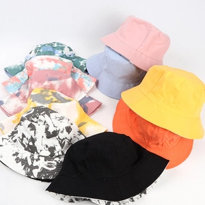 Collection of colorful cotton bucket hats in solid colors and vibrant tie-dye patterns