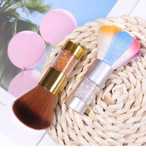 Macro detail of two nail dust brushes with colorful glitter acrylic handles and soft bristles