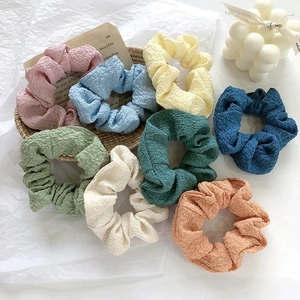 Close-up of eight-piece set colorful bubble texture mesh hair scrunchies with elastic band