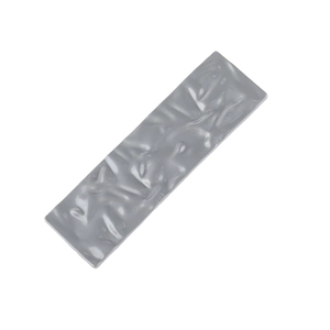Close-up of a grey rectangular duckbill clip with a unique textured matte crinkle finish