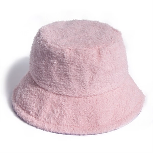 Detail of soft pink teddy fleece bucket hat showing thick plush texture and round crown