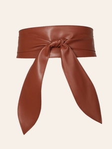 Detail of brown PU leather wrap obi belt featuring a soft texture and elegant waist tie knot