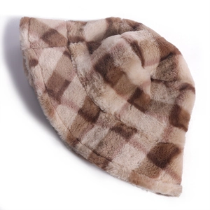 Detail view of a brown checkered fuzzy plush bucket hat for winter warmth