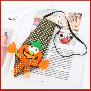 Close-up of Halloween sequin necktie for kids featuring a 3D orange pumpkin motif