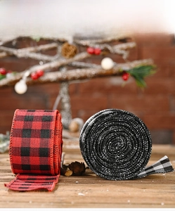 Close-up of red and black buffalo plaid Christmas ribbons for festive gift wrapping
