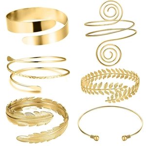 Set of 6 gold copper arm cuffs featuring laurel leaves, feathers, and beads