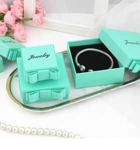 Mint green jewelry gift boxes with satin bows and velvet lining for rings and bracelets