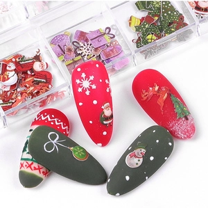 Detailed view of Christmas nail art wood pulp flakes with Santa and snowman patterns