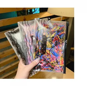 Close-up of colorful elastic hair bands in a frosted zipper pouch with assorted vibrant colors