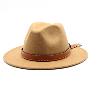 Detail of camel wool fedora hat featuring a brown leather band with fine stitching