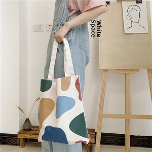 Artistic canvas tote bag with abstract blocks and thick handles for daily use