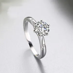 Classic six-prong platinum plated moissanite ring with leaf-shaped side micro-pave diamonds