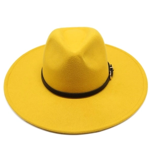 Top view of bright yellow wool fedora hat with wide brim and black leather buckle belt