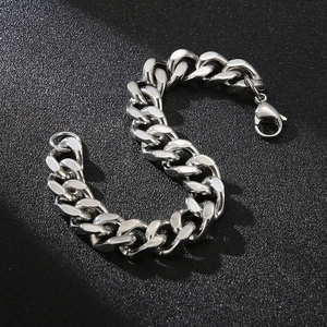 Detail of silver Cuban chain bracelet with lobster clasp and thick stainless steel links