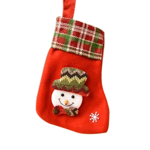 Red felt Christmas stocking featuring 3D snowman and plaid cuff on white background