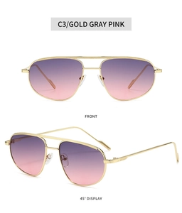 Detail view of gold double-bridge metal sunglasses with purple-pink gradient lenses
