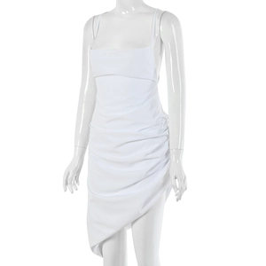 Detail of white spaghetti strap mini dress featuring ruched fabric and asymmetric hemline