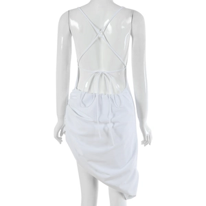 Detail view of a white backless dress with tie-up straps and irregular stitching