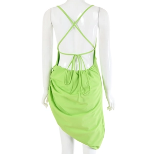 Detailed view of the open back design and adjustable lace-up ties on the green dress