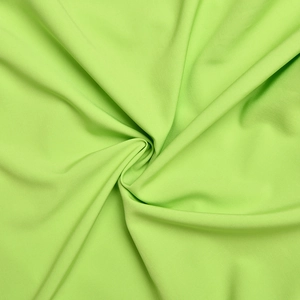 Detailed view of the lime green soft matte fabric with smooth texture and elegant drapes