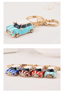 Detailed view of four colorful mini car keychains with alloy enamel and crystal accents