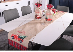 Christmas burlap table runner with red vintage truck pattern and plaid border accents