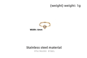 Detail view of a slim gold stainless steel ring featuring a single clear zircon stone