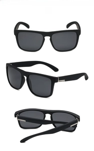 Three perspectives of matte black polarized sports sunglasses with metal branding detail