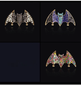 Detailed views of vintage bat brooches with colorful rhinestones in multiple color options
