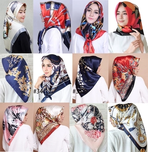 Detailed grid of twelve silk-feel satin scarves featuring vintage chain and floral patterns