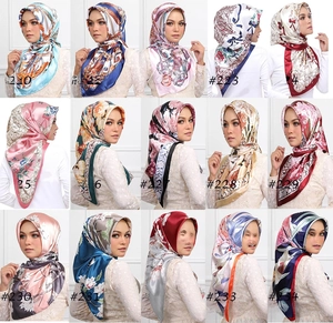 Detail view showing 15 different elegant satin silk square scarves with vintage floral prints