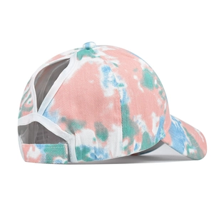 Detail of tie-dye ponytail sun hat featuring a V-shaped back opening and velcro closure