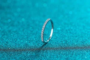 Macro shot of S925 sterling silver eternity ring with sparkling round moissanite stones