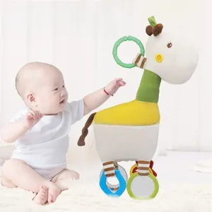 Detail view of giraffe plush stroller toy with colorful patterns and a green grasping ring