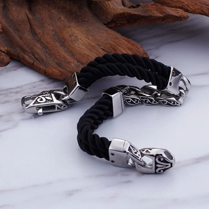 Men's double-layered black nylon braided bracelet with vintage steel totem engraving