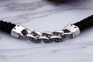 Macro detail of vintage geometric titanium steel clasp with double-layer nylon braided cord