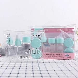 Detail of travel bottle set with spray and lotion pumps in a clear PVC zipper bag