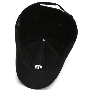 Interior view of black short brim cotton baseball cap showing lining and m logo