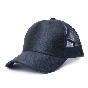 Detail of dark blue glitter baseball cap showing sequin texture and mesh back