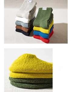 Detail of multi-color cushioned crew socks with thick terry knit and ribbed texture