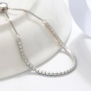Macro detail of S925 silver bracelet with multicolor gemstones and adjustable sliding clasp
