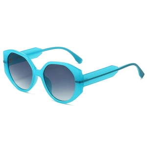 Lunettes de soleil géométriques bleu sarcelle à monture ronde et verres dégradés