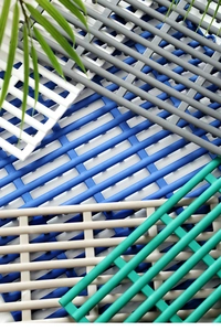 Detail of multi-color interlocking TPE bathroom mats with non-slip mesh drainage design