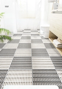 Detail view of TPE bathroom drainage tiles with non-slip dual-layer grid design