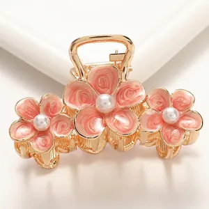 Elegant gold flower hair claw clip with pink enamel petals and pearls, 6.8cm medium size