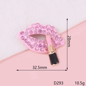 Detailed view of pink rhinestone lips and lipstick brooch with dimensions 32.5mm and 28mm