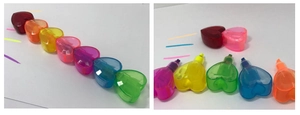Close-up of heart-shaped multi-color highlighters showing vivid ink strokes and tips