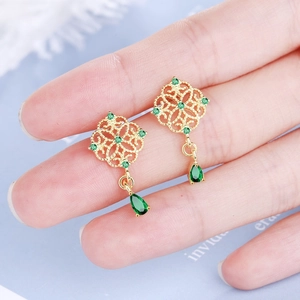 Vintage Chinese style gold earrings with emerald green teardrop tassels and lattice detail