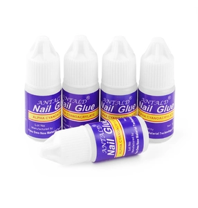 Detailed view of 3g nail glue bottles with secure screw caps for professional nail art