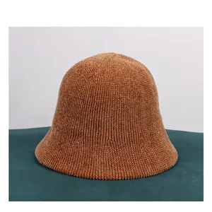 Detail shot of the warm brown chenille bucket hat with a thick vertical knit texture